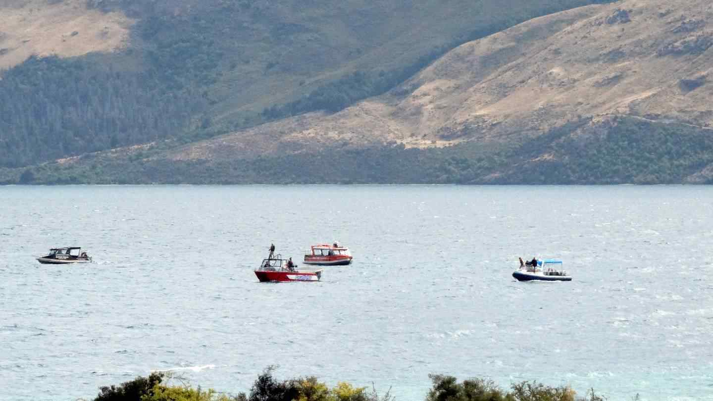 Boats search for skydiver Tyler Nii after he crash landed in Lake Wakatipu